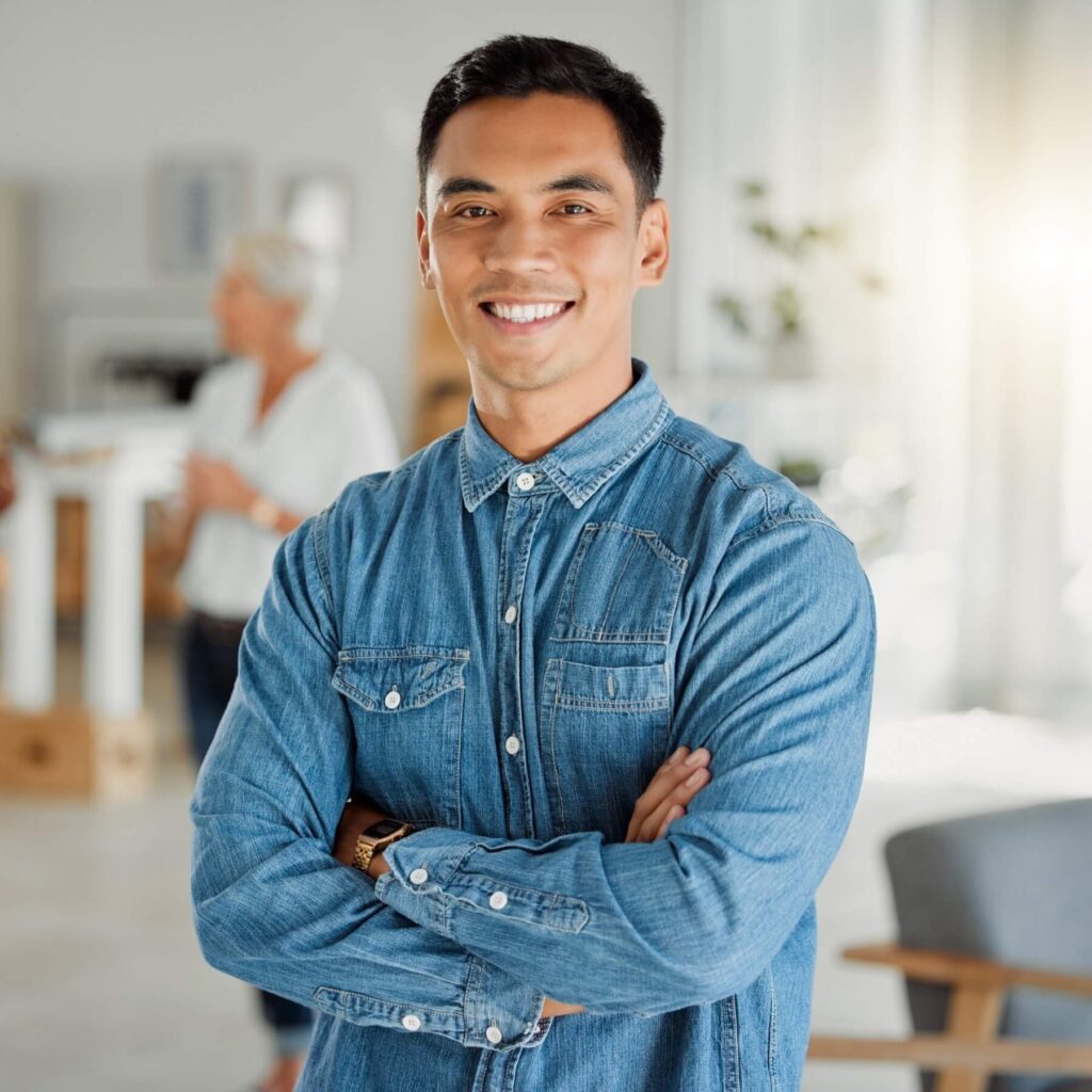 portrait of a happy asian businessman standing wit 2025 04 06 11 22 23 utc 3AKL7JR